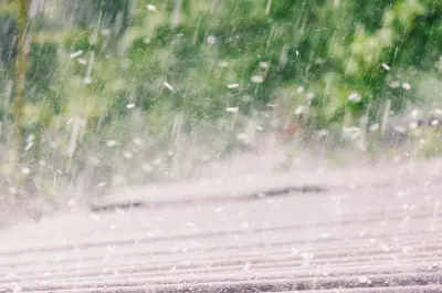 hail coming down on a rooftop.