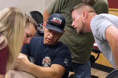 instructor demonstrating first aid